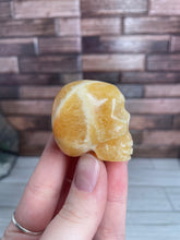 Load image into Gallery viewer, Orange Calcite Skull Carving